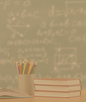 Books and a pencil holder on a teacher's desk at the international school in Paris